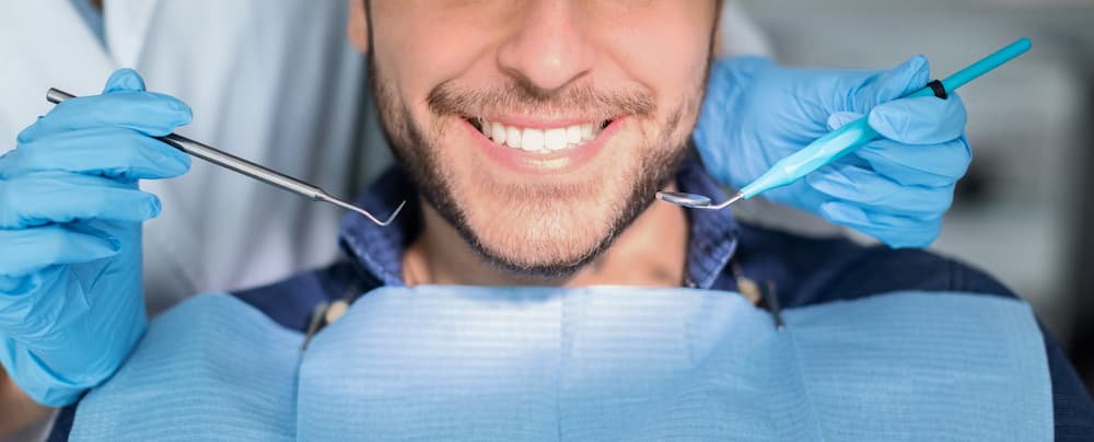 unrecognizable male patient having teeth whitening 2021 09 03 07 00 35 utc 1